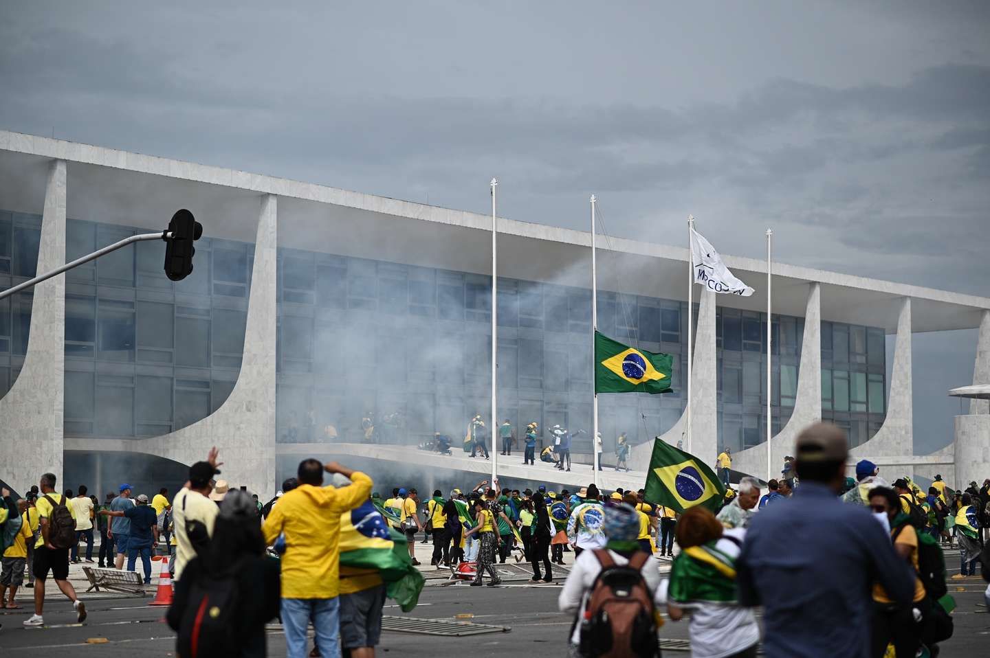 epaselect epa10396226 Bolsonaro supporters storm the National Congress in Brasilia, Brazil, 08 January 2023. Hundreds of supporters of former Brazilian President Jair Bolsonaro invaded the headquarters of the National Congress, and also Supreme Court and the Planalto Palace, seat of the Presidency of the Republic, in a demonstration calling for a military intervention to overthrow President Luiz Inacio Lula da Silva. The crowd broke through the cordons of security forces and forced their way to the roof of the buildings of the Chamber of Deputies and the Senate, and some entered inside the legislative headquarters.  EPA/ANDRE BORGES