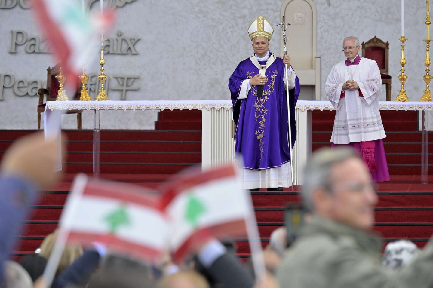 epa12564116 Pope Leo XIV (L) at the end of a Mass at the waterfront in Beirut, Lebanon, 02 December 2025. Pope Leo XIV is on his first apostolic visit outside Italy since his election as pontiff. He visited Turkey from 27 November and continues his journey to Lebanon from 30 November until 02 December.  EPA/STRINGER