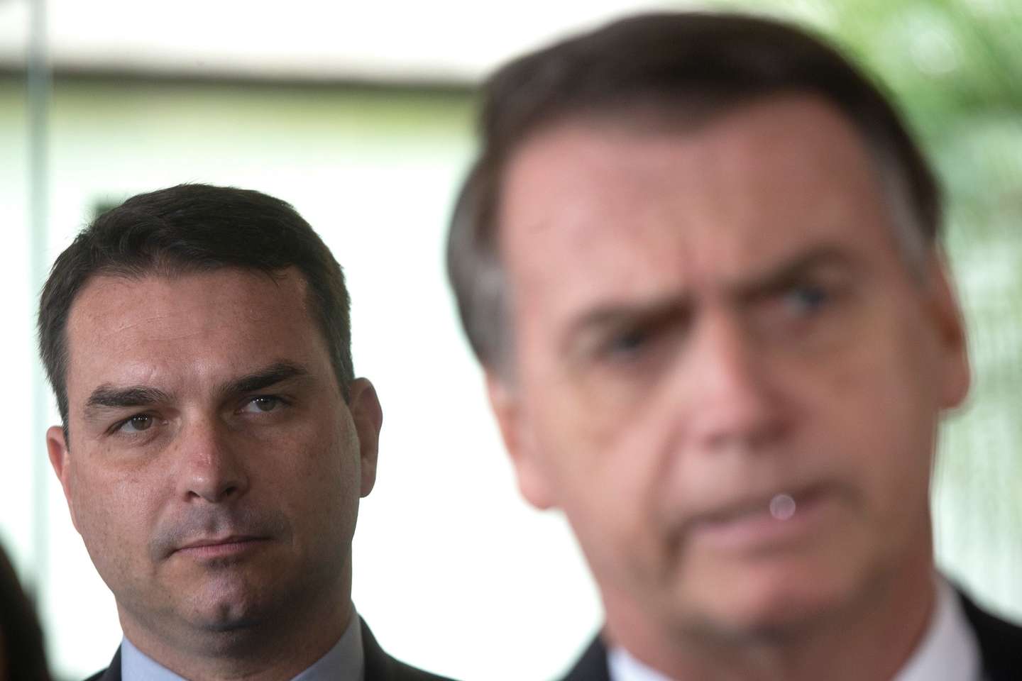 epa08628612 (FILE) - Then Brazilian President-elect Jair Bolsonaro (R) and his son, then elected senator Flavio Bolsonaro (L), arrive at the Supreme Court of Justice for a press conference in Brasilia, Brazil, 07 November 2018 (reissued 27 August 2020). According to the senator's office statement, the eldest son of Brazilian President Jair Bolsonaro, Senator Flavio Bolsonaro, said he has tested positive for the new coronavirus.  EPA/Joedson Alves *** Local Caption *** 54757503