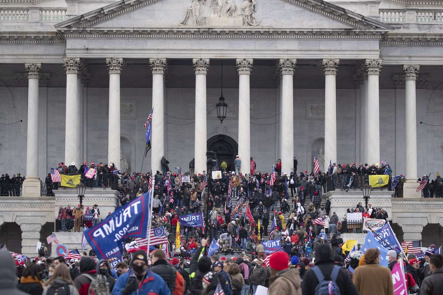 epa08923521 Pro-Trump protesters storm the grounds of the East Front of the US Capitol, in Washington, DC, USA, 06 January 2021. Right-wing conservative groups are protesting against Congress counting the electoral college votes. Dozens of state and federal judges have shot down challenges to the 2020 presidential election, finding the accusations of fraud to be without merit. Protesters stormed the US Capitol which held the Electoral College vote certification for President-elect Joe Biden.  EPA/MICHAEL REYNOLDS