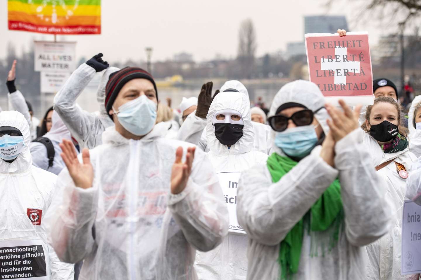 epa08991684 People demonstrate at a rally organized by the association 'Silent Protest' against the restrictions and measures taken by the Swiss federal government during the Coronavirus Covid-19 pandemic,in Zug, Switzerland, 06 February 2021.  EPA/URS FLUEELER