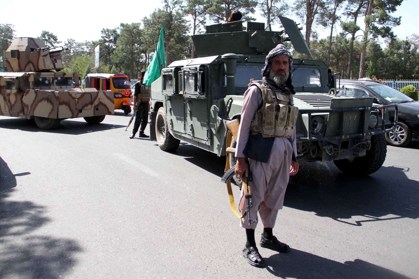 epa09403516 Afghan security officials and private militia loyal to Ismail Khan, the former Mujahideen commander patrol after they took back control of parts of Herat city following intense battle with Taliban militants, in Herat, Afghanistan, 07 August 2021. Heavy fighting continued in Kandahar, Lashkargah, and Herat cities as the Taliban continued pressing on with their surge in Afghanistan and breaking through a tough resistance by the government forces. The fighting in Herat displaced hundreds of families as people left their houses to seek refuge in central parts of the city, mostly settling with relatives.  EPA/JALIL REZAYEE