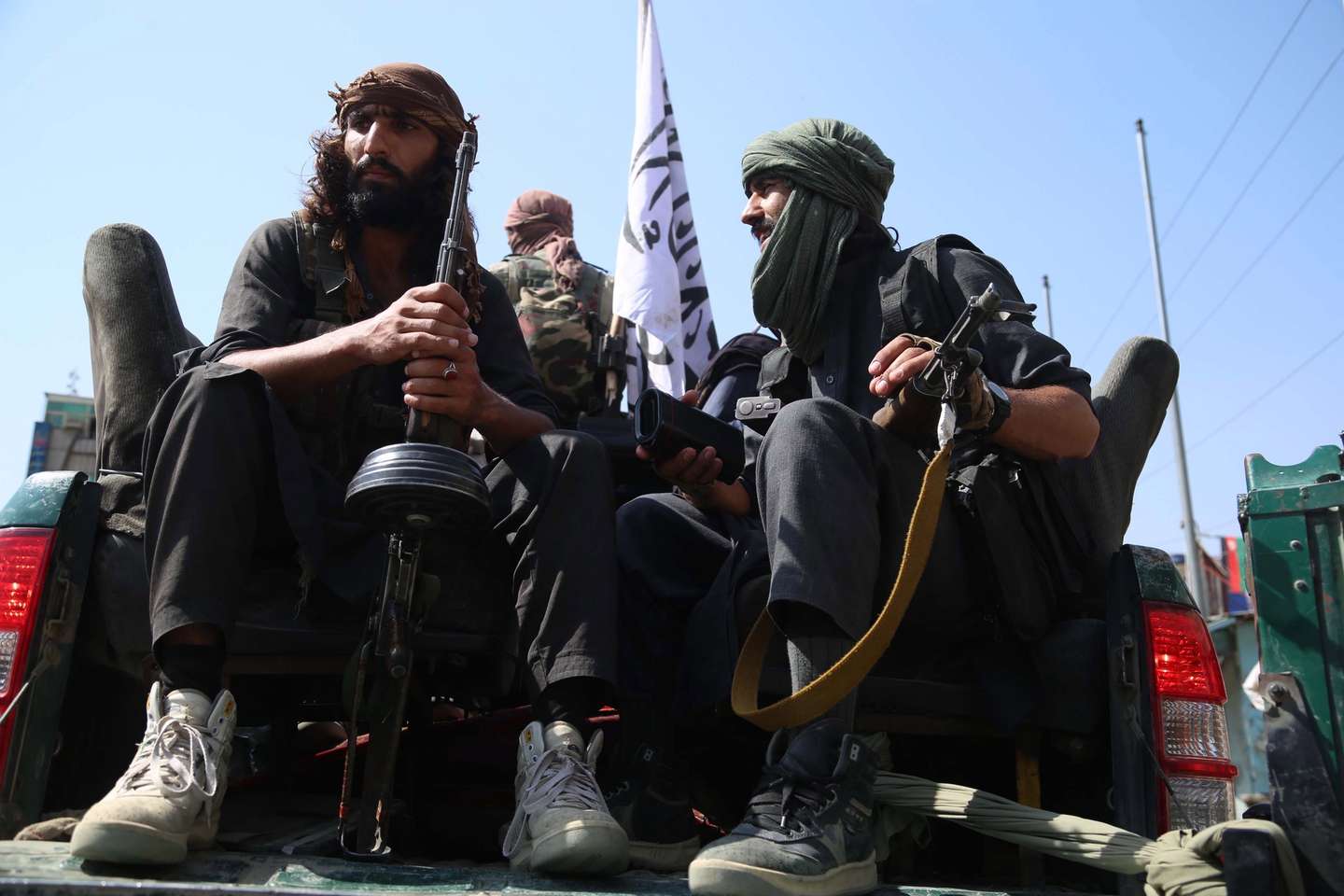 epa09417420 Taliban fighters patrol in Jalalabad, Afghanistan, 17 August 2021. Taliban co-founder Abdul Ghani Baradar on 16 August  declared victory and an end to the decades-long war in Afghanistan, a day after the insurgents entered Kabul to take control of the country. Baradar, who heads the Taliban political office in Qatar, released a short video message after President Ashraf Ghani fled and conceded that the insurgents had won the 20-year war.  EPA/STRINGER
