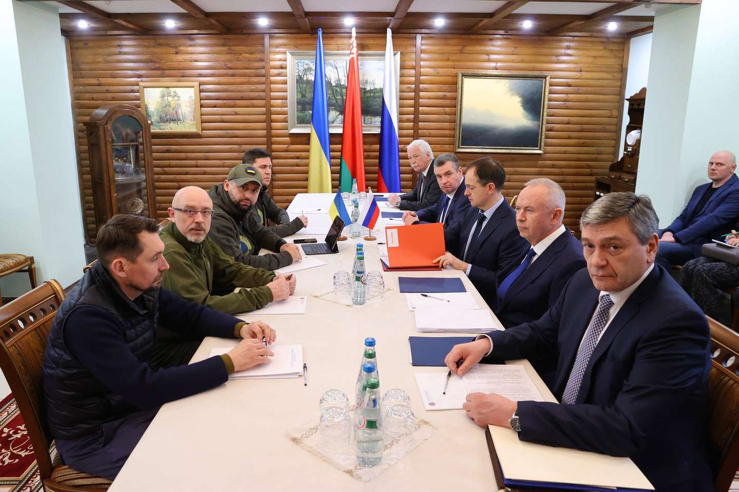 epa09807683 A handout photo made available by BelTA news agency shows head of Russian delegation, Russian presidential aide Vladimir Medinsky (3-R), Ukrainian Defence Minister Oleksii Reznikov (2-L) and other Russian (R) and Ukrainian (L) delegations members attend Russia-Ukraine ceasefire negotiations, at an undisclosed location in the Brest region, Belarus, 07 March 2022. Russian troops entered Ukraine on 24 February prompting the country's president to declare martial law and triggering a series of severe economic sanctions imposed by Western countries on Russia.  EPA/MAXIM GUCHEK / BELTA HANDOUT MANDATORY CREDIT HANDOUT EDITORIAL USE ONLY/NO SALES