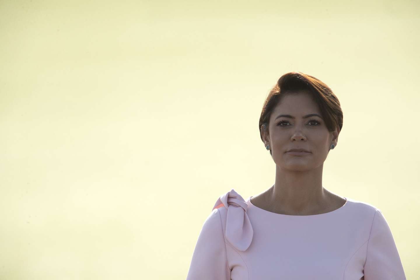 epa09810342 Brazil's first lady Michelle Bolsonaro is seen after a ceremony to raise the national flag in honor of International Women's Day, at the Palacio da Alvorada in the city of Brasilia, Brazil, 08 March 2022. The first lady mentioned in a brief speech that her husband is 'the most rosy president in the world.'  EPA/Joedson Alves