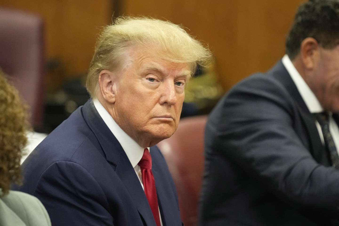 epa10558784 Former US President Donald J. Trump sits in the courtroom for his arraignment in New York Criminal Court in New York, New York, USA, 04 April 2023. A Manhattan grand jury voted to indict former President Donald J. Trump last week.  EPA/SETH WENIG POOL