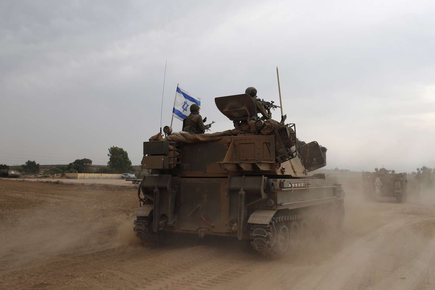 epaselect epa10909875 Israeli soldiers on military vehicles maneuver at an area along the border with Gaza, southern Israel, 09 October 2023. Israeli chief military spokesperson Rear-Admiral Daniel Hagari said on 09 October that the country had drafted a record of 300,000 reservists. More than 700 Israelis were killed and over 2,000 were injured since the Islamist movement Hamas carried out an unprecedented attack on southern Israel on 07 October, the Israeli army said. According to Palestinian officials, more than 500 people were killed and nearly 3,000 were injured as a result of Israel’s retaliatory raids and air strikes in the Palestinian enclave.  EPA/ATEF SAFADI