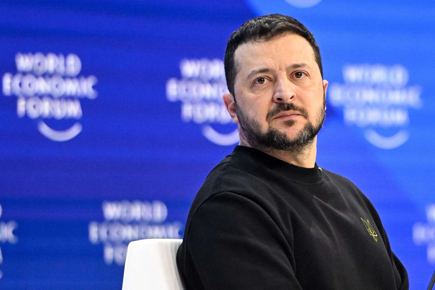 epa11082746 Ukrainian President Volodymyr Zelensky looks on during a plenary session in the Congress Hall at the 54th annual meeting of the World Economic Forum (WEF) in Davos, Switzerland, 16 January 2024. The meeting brings together entrepreneurs, scientists, corporate and political leaders in Davos under the topic 'Rebuilding Trust' from 15 to 19 January.  EPA/Radek Pietruszka POLAND OUT
