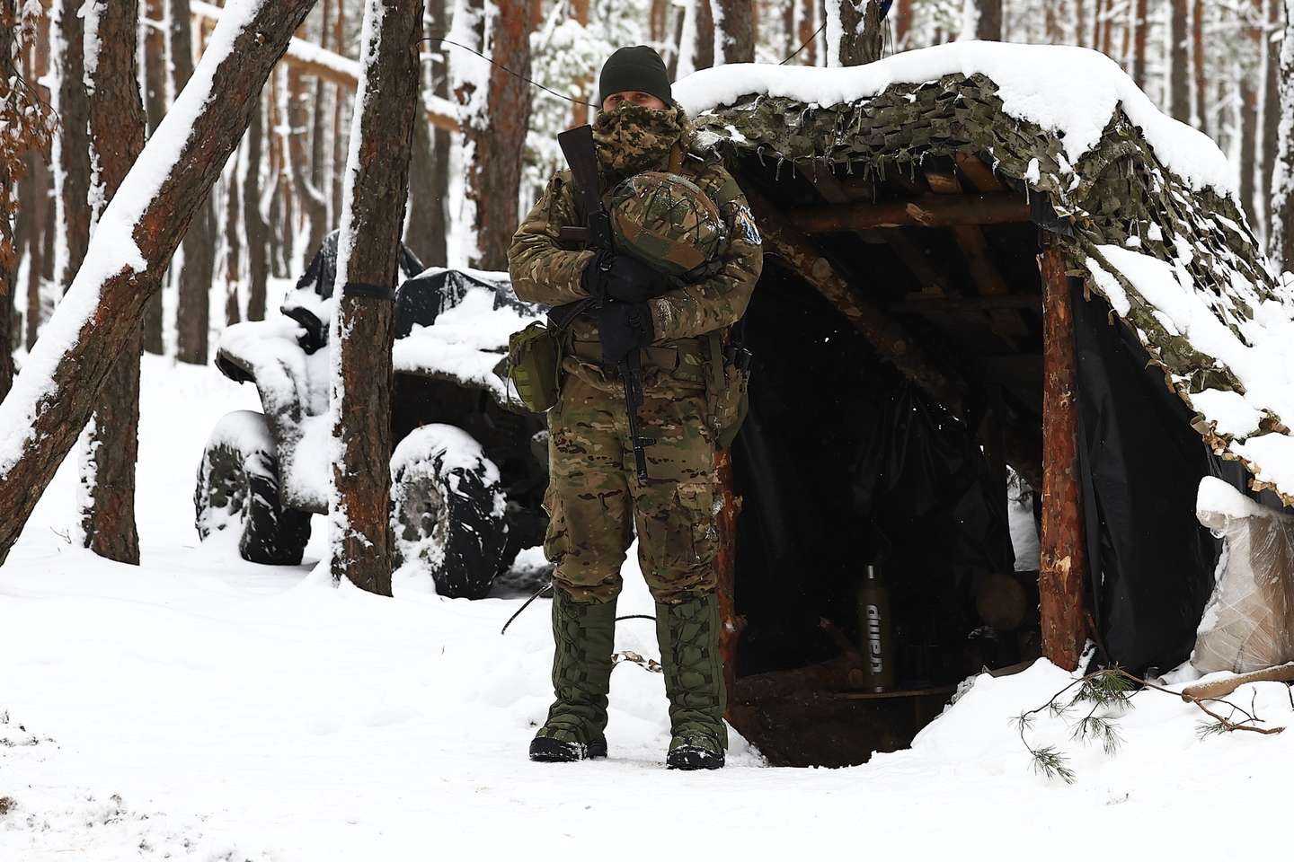 A soldier of Khartia brigade stands guard at a Ukrainian defence position in Kupiansk-Lyman, in the Donbass region, Ukraine, 10 February 2024.  Russian troops entered Ukrainian territory on 24 February 2022, starting a conflict that has provoked destruction and a humanitarian crisis.  ANTONIO COTRIM/LUSA