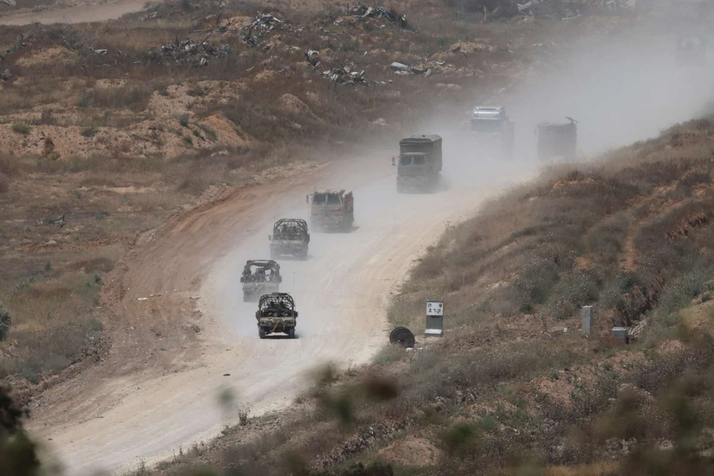 epa11297706 Israeli troops patrol the road that separates northern and southern Gaza Strip, as seen from an undisclosed location on the Israeli side of the border, 24 April 2024. More than 34,000 Palestinians and over 1,450 Israelis have been killed, according to the Palestinian Health Ministry and the Israel Defense Forces (IDF), since Hamas militants launched an attack against Israel from the Gaza Strip on 07 October 2023, and the Israeli operations in Gaza and the West Bank which followed it.  EPA/ATEF SAFADI