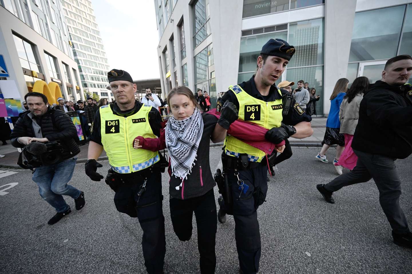 epaselect epa11333733 Swedish climate activist Greta Thunberg (C) is removed by police outside Malmo Arena during a pro-Palestinian rally against the participation of Israel in the 68th Eurovision Song Contest (ESC) in Malmo, Sweden, 11 May 2024. Protesters call for Israel's expulsion from the singing contest over the ongoing situation in the Gaza Strip. In 2022 Russia was prevented from participating in Eurovision over its invasion of Ukraine.  EPA/Johan Nilsson/TT SWEDEN OUT