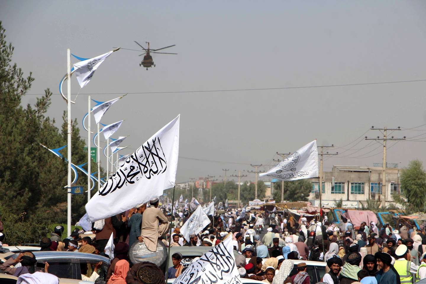 epa11548690 Supporters of Taliban authorities mark the third anniversary of the Afghan government takeover in Kandahar, Afghanistan, 14 August 2024. The Taliban seized control of Kabul on 15 August 2021, following the collapse of the US-backed government amidst the chaotic withdrawal of foreign troops. Despite their consolidation of power and claims of improved security, the Taliban government remains unrecognized internationally, facing criticism for severe restrictions on women and a worsening humanitarian crisis affecting 23.7 million Afghans in need of assistance.  EPA/QUDRATULLAH RAZWAN