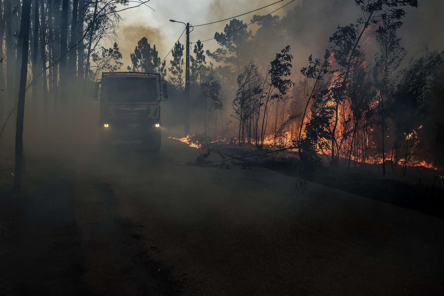 Firefighters fight a forest fire in Soutelo, Albergaria-a-Velha, Portugal, 16 September 2024. Around 70 people had to be evacuated and at least five properties, including homes, were hit by flames in different rural fires that broke out between Sunday and today in the North and Centre regions, according to Civil Protection. 196 operationaland 58 vehicles are fighting the forest fire. PAULO NOVAIS/LUSA