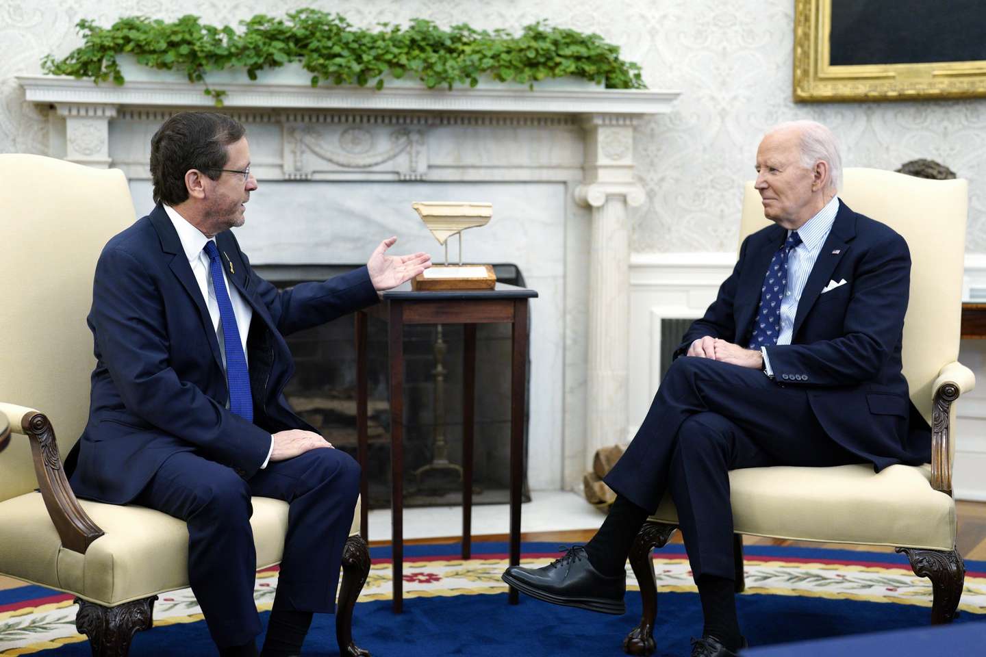 epa11716737 President Isaac Herzog (L) of Israel presents a gift, an artifact from the foot of Temple Mount in Jerusalem that has the word 'Joseph' on it, to US President Joe Biden (R), as they meet in the Oval Office at the White House in Washington, DC, USA, 12 November 2024. President Biden is pushing for progress in the cease fire talks for Gaza and Lebanon prior to President-elect Donald Trump's inauguration in January 2025.  EPA/YURI GRIPAS / POOL