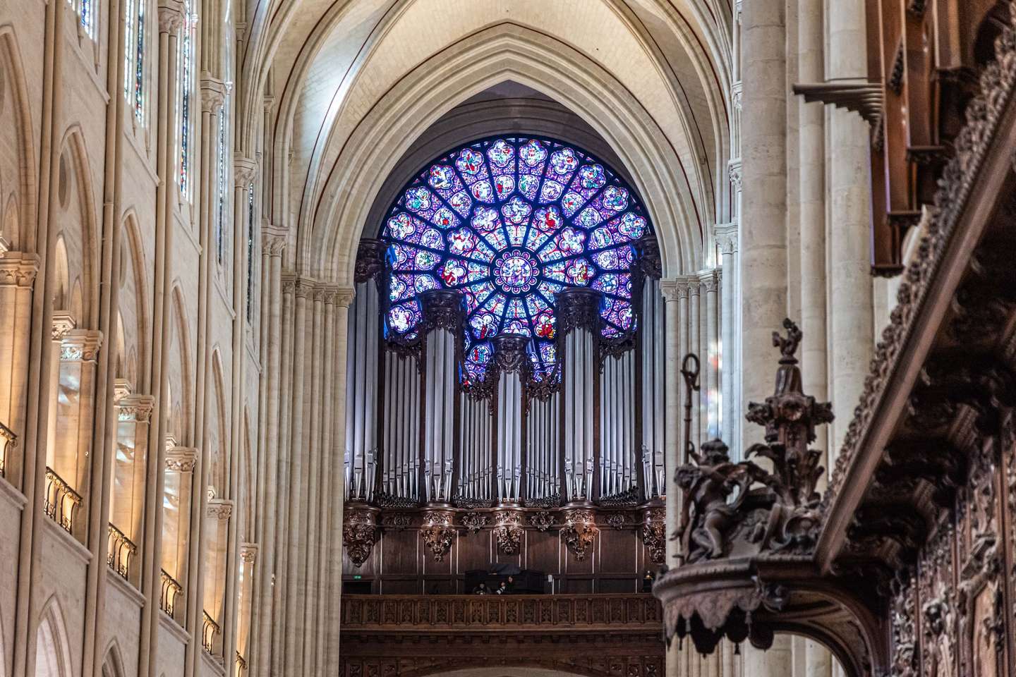 epa11747987 View of the stained glass rose window and the great organs during the visit of the French President Macron (R) to Notre-Dame de Paris cathedral in Paris, France, 29 November 2024. French President Macron is visiting the cathedral's construction site on 29 November, to thank the donors and people who worked to rebuild the monument after it was severely damaged in a fire that broke out on 15 April 2019. The Paris Cathedral will be officially inaugurated after nearly six years of renovation work on 07 December 2024.  EPA/CHRISTOPHE PETIT TESSON / POOL
