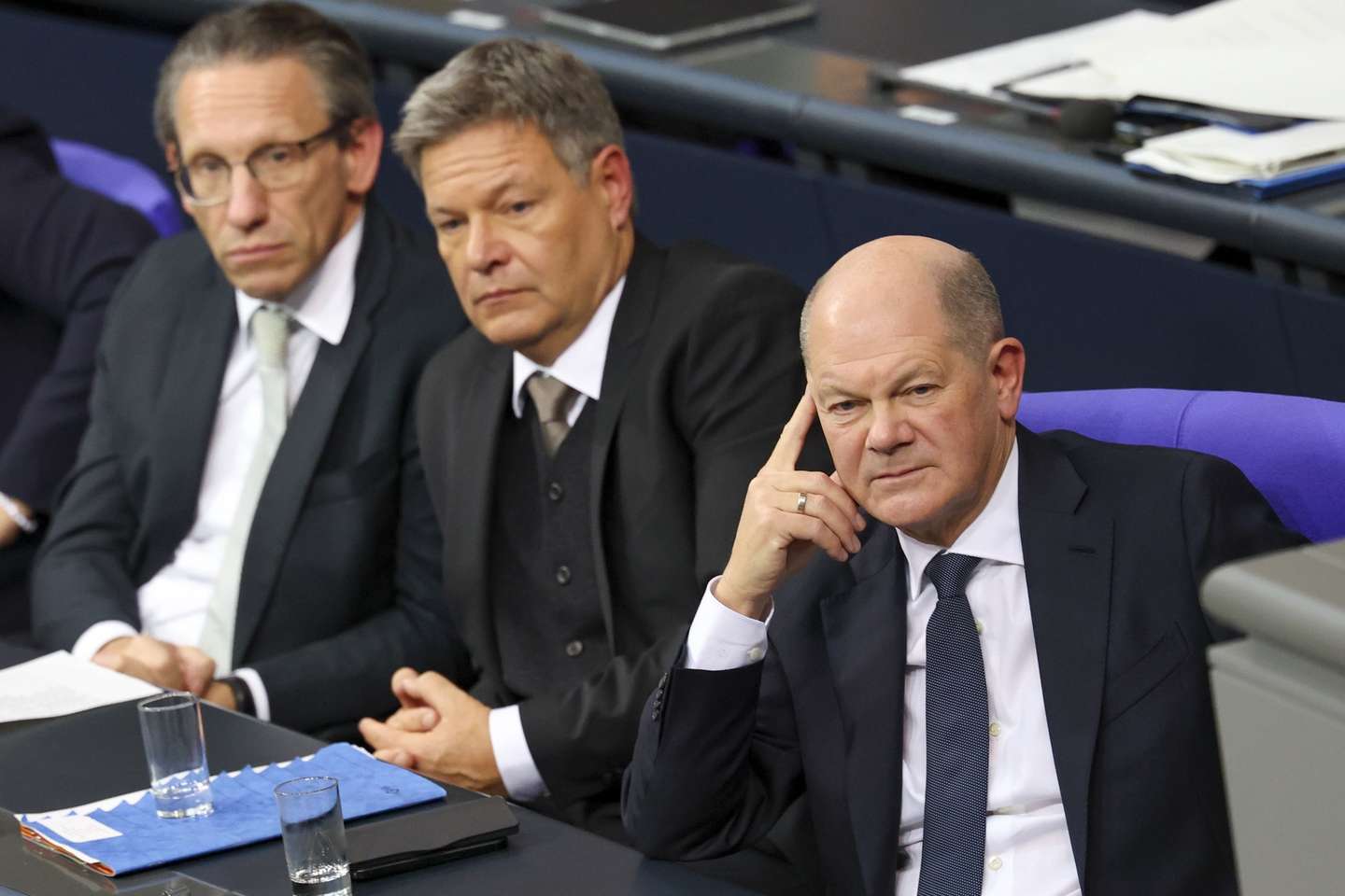 epa11780805 German Finance Minister Joerg Kukies (SPD) (L), German Minister for Economy and Climate Action Robert Habeck (C) and German Chancellor Olaf Scholz (R) attend the meeting of the German Bundestag on the vote of confidence in the Chancellor, in Berlin, Germany, 16 December 2024. Scholz has submitted a motion for a vote of confidence in the German Bundestag to pave the way for new elections.  EPA/FILIP SINGER