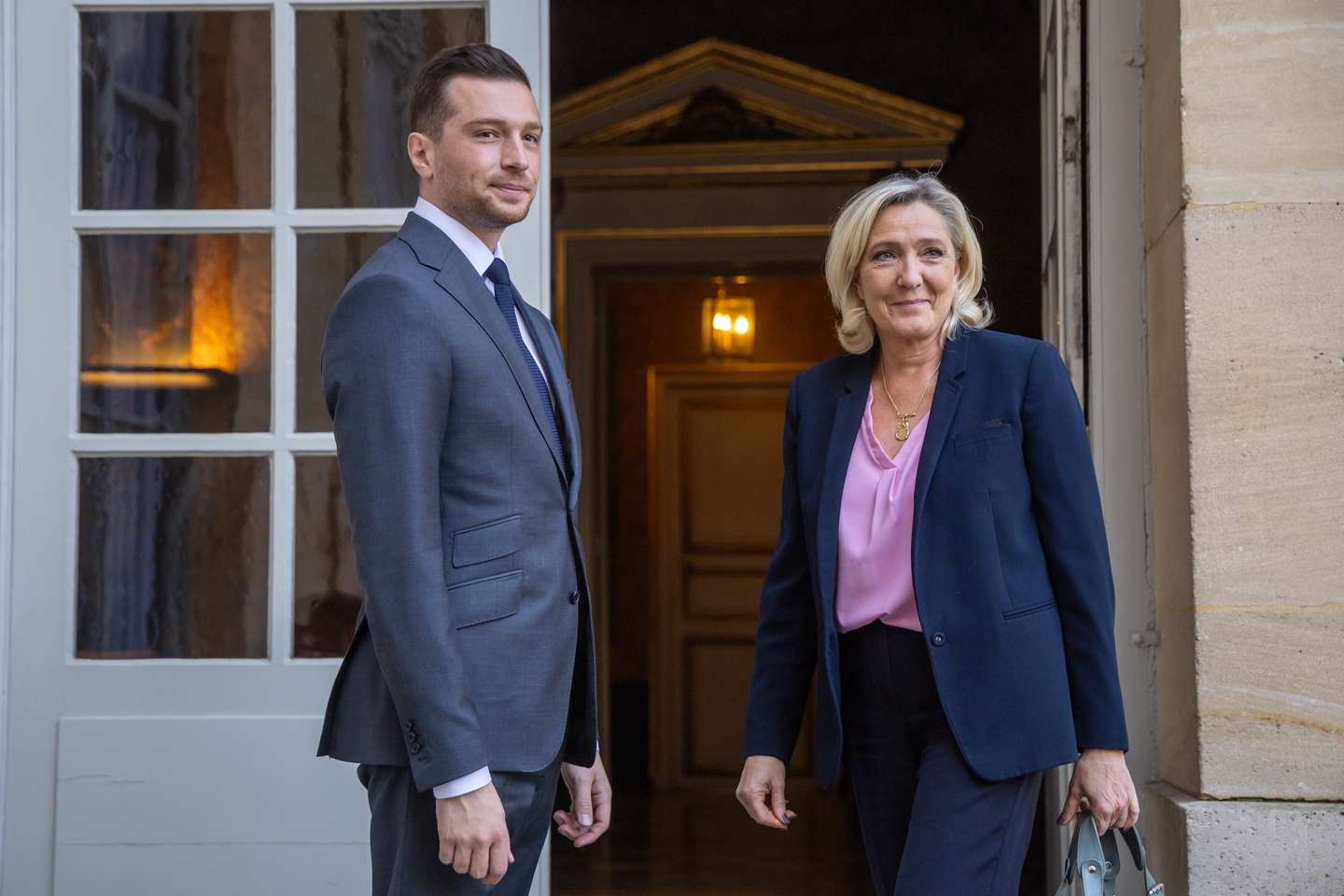 epa12064517 President of the far-right Rassemblement National (RN) parliamentary group, Marine Le Pen (R), and RN President Jordan Bardella (L) arrive for a meeting with the French prime minister as part of the consultations on a reform of the electoral system and proportional voting, at Hotel Matignon in Paris, France, 30 April 2025.  EPA/CHRISTOPHE PETIT TESSON