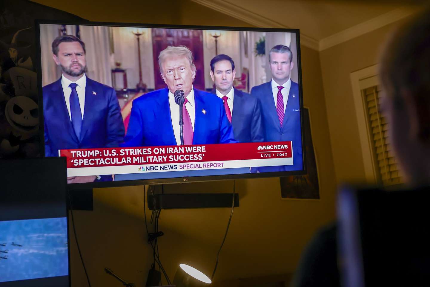 epa12190352 Young people watch US President Donald Trump address the nation following the U.S. attack on Iran's nuclear sites, in Miami, Florida, USA, 22 June 2025. President Trump stated that the Fordow enrichment facility was obliterated by U.S. airstrikes.  EPA/CRISTOBAL HERRERA-ULASHKEVICH