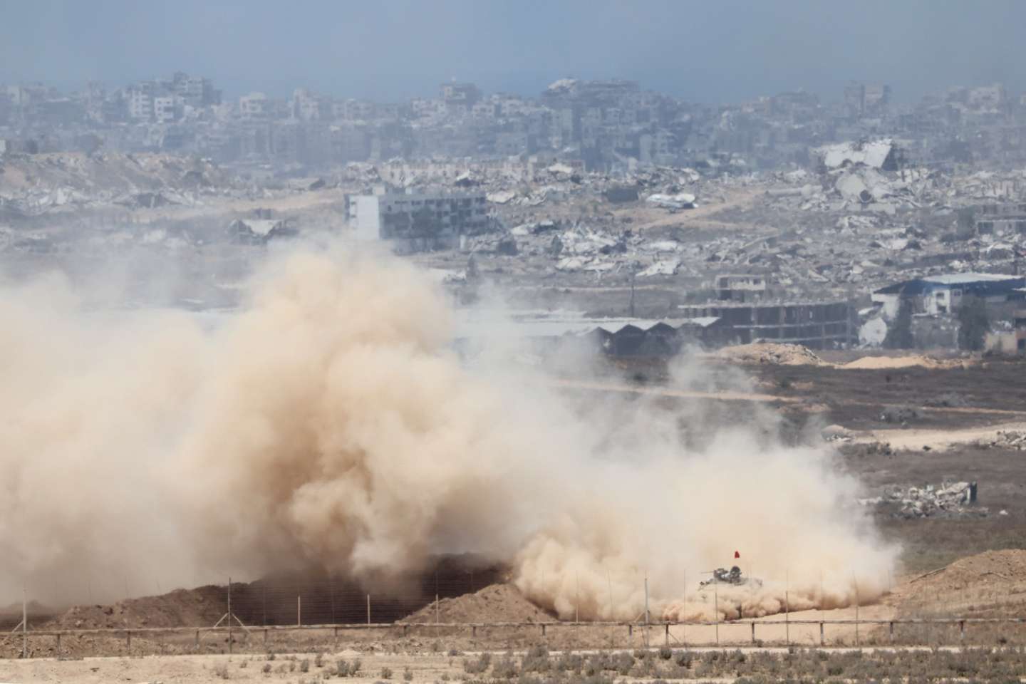 epaselect epa12281181 Israeli army vehicles maneuver inside the Gaza Strip, as seen from the Israeli side of the border with Gaza, in southern Israel, 03 August 2025.  EPA/ABIR SULTAN
