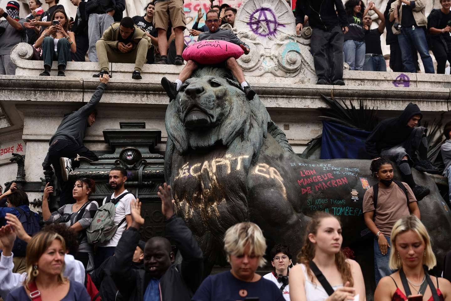 epa12367625 Protesters gather for a rally against austerity measures following a call for action by the 'Bloquons tout' (Block everything) collective at the 'Place de la Republique' square in Paris, France, 10 September 2025. To protest against the outgoing government's austerity budget, an online collective called 'Bloquons Tout' has called for everyone to block the entire country on 10 September with symbolic actions. France will deploy 80,000 police officers and gendarmes with instructions to stand firm against protesters.  EPA/Teresa Suarez