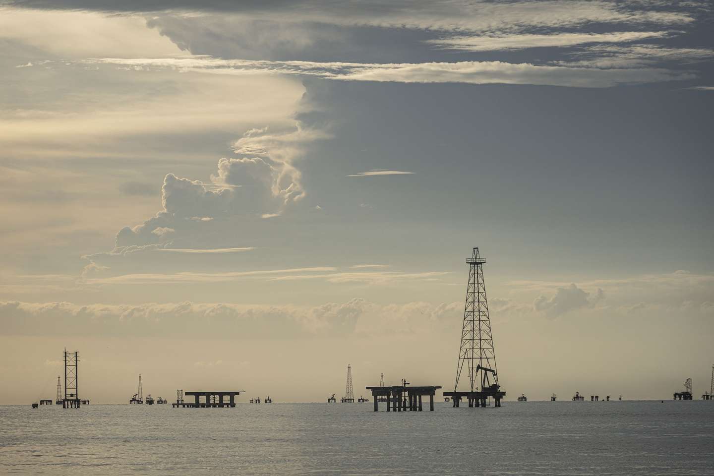 epa12702216 Offshore oil rigs in Cabimas, Venezuela, 31 January 2026 (issued 03 February 2026). Under the leadership of Chavismo leader Delcy Rodriguez, who took office as acting president after then-President Nicolas Maduro was captured by the US following military strikes on the oil-rich country a month ago, Venezuela has decided to relinquish state control over its oil industry and open the doors to private and foreign capital by substantially reforming the Organic Law on Hydrocarbons, a measure that analysts interpret as dismantling the legacy of the late President Hugo Chavez.  EPA/HENRY CHIRINOS