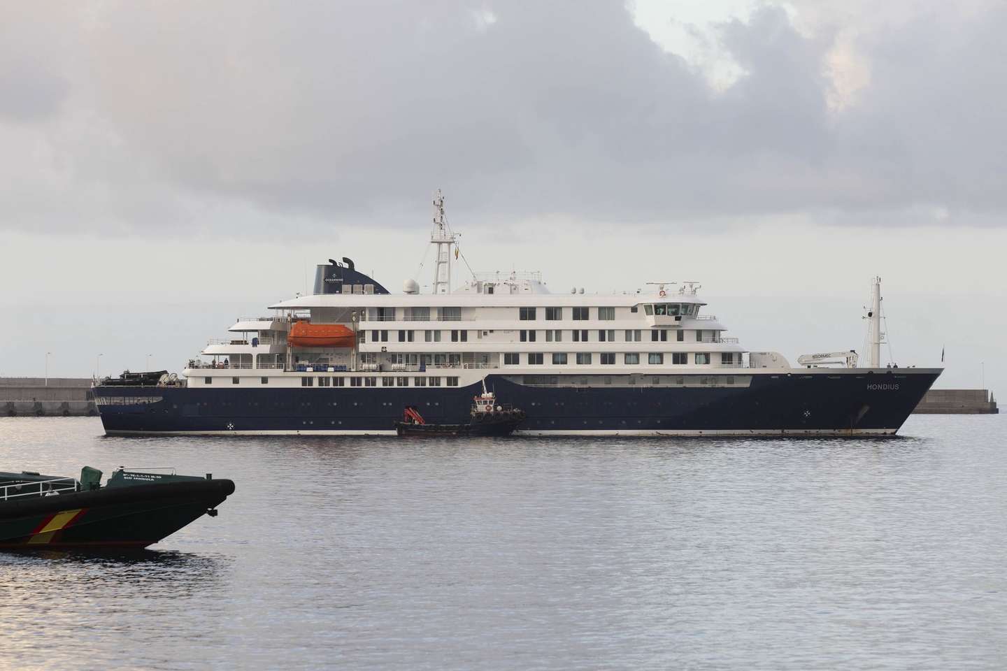 epa12944933 The Dutch-flagged vessel MV Hondius, affected by a hantavirus outbreak during its voyage across the South Atlantic, arrives at the port of Granadilla de Abona, Spain, 10 May 2026, to anchor and disembark its passengers. According to the World Health Organization, eight cases of hantavirus, including three deaths, have been reported on the cruise ship.  EPA/Miguel Barreo