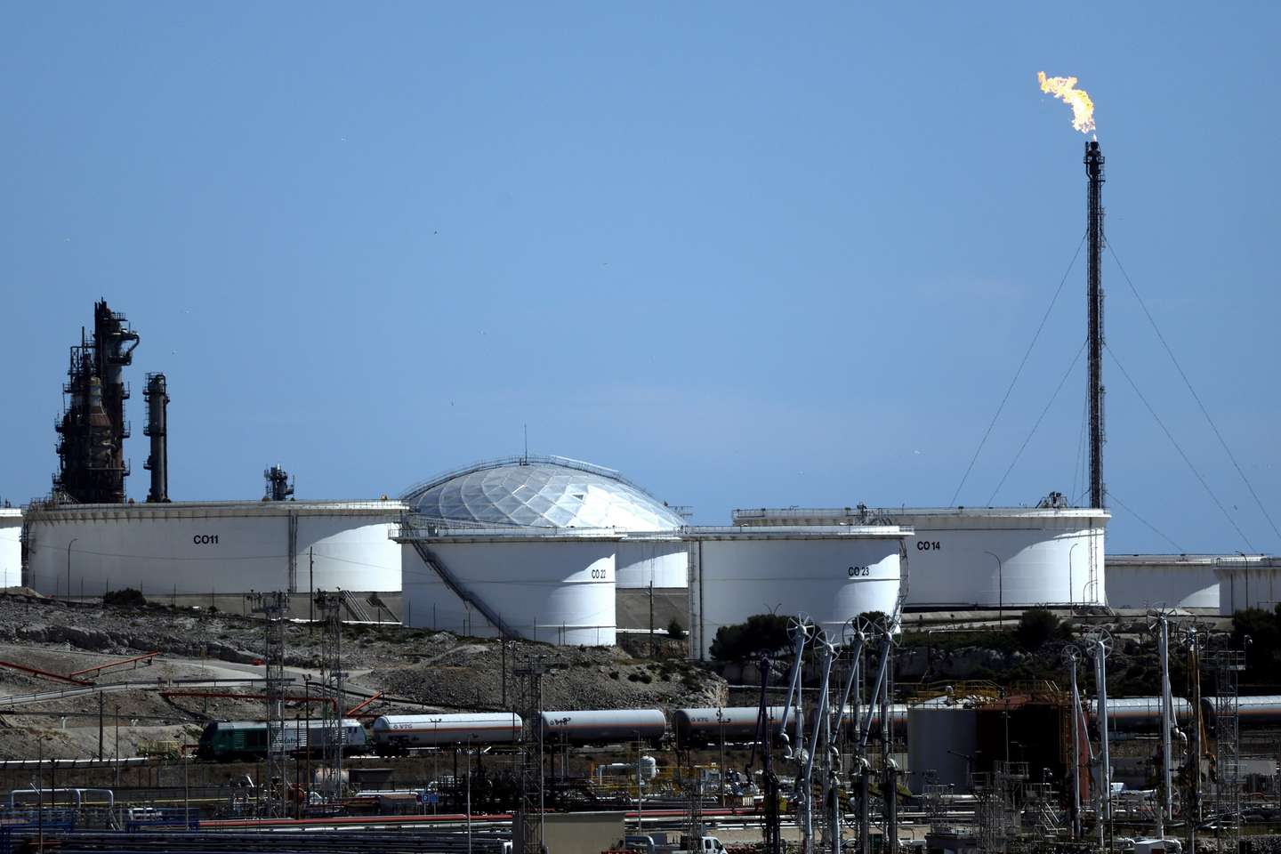 epa12947938 A cargo train crosses the refinery of Lavera in Martigues, Southern France, 11 May 2026. Due to the conflict in the Middle East, the international oil benchmark Brent Crude surged past 103 US dollars per barrel. The hike follows a surge in global oil prices and supply disruptions in the Strait of Hormuz linked to the ongoing conflict involving Iran, Israel, and the United States.  EPA/GUILLAUME HORCAJUELO