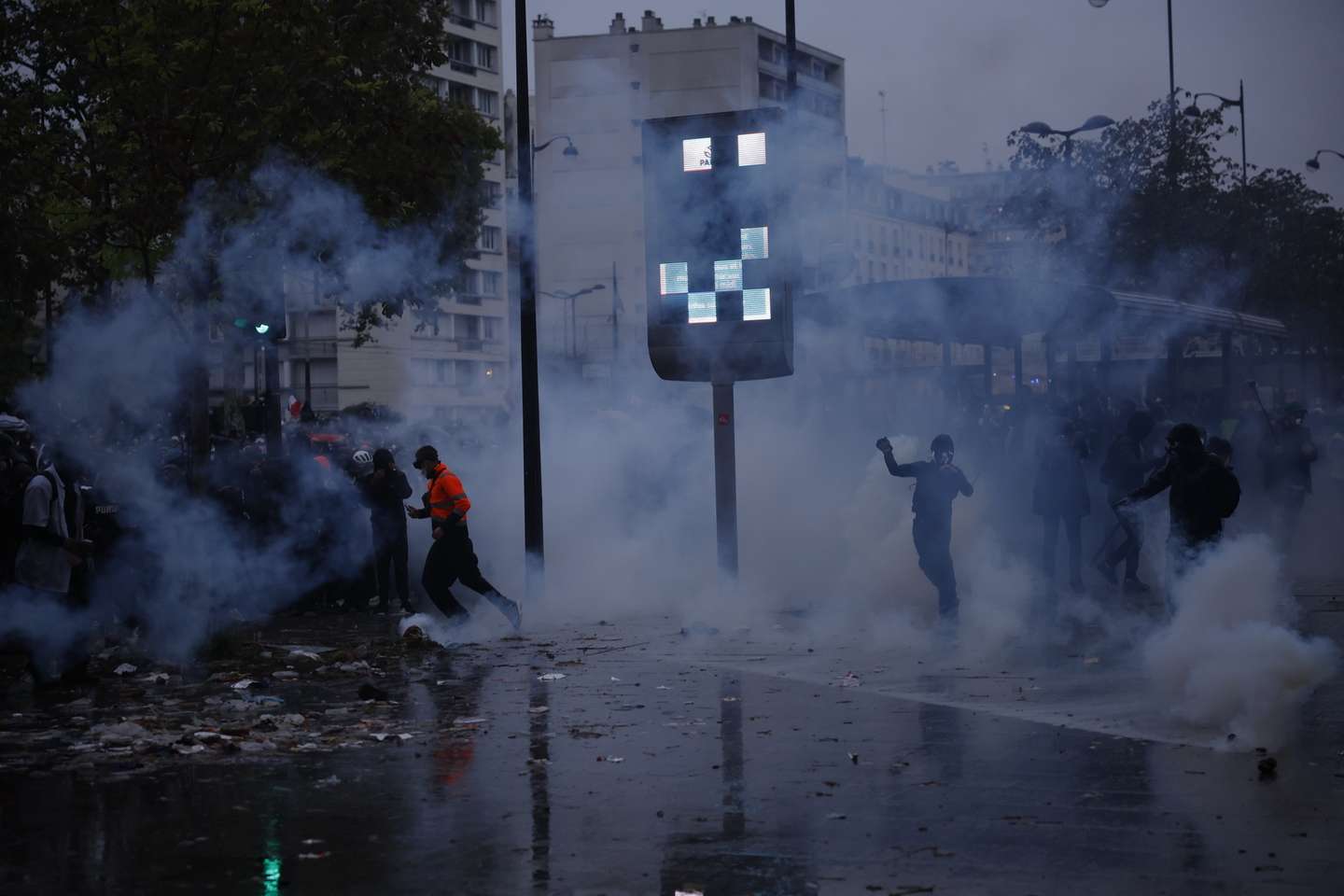 epa13328683 Protesters clash with riot police during a demonstration against rising living costs and cuts to public services in Paris, France, 24 October 2026. Around 70,000 police and security personnel are deployed across France following violent nationwide protests on 17 October 2026 involving Yellow Vest (Gilets Jaunes) activists, high school and university students, trade unions and other groups protesting against rising fuel prices and deteriorating public services.  EPA/YOAN VALAT