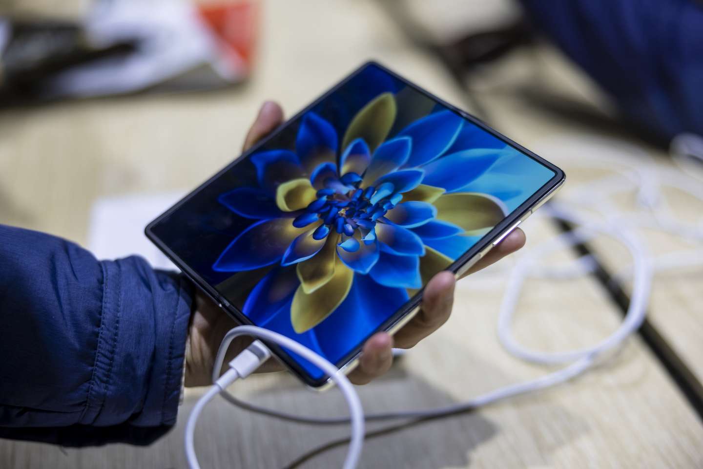 epa09030923 An employee showcases Huawei's new 5G Mate X2 foldable phone at the MWC (Mobile World Congress) Shanghai 2021 in Shanghai, China, 23 February 2021. Asia's Tech Event of the year, MWC Shanghai 2021, is taking place at the Shanghai new International Expo Centre. It is one of the first in-person events since the COVID-19 breakout. The themes of the events are 5G connectivity, Artificial Intelligence, Connected Industry, and Start-up Innovations.  EPA/ALEX PLAVEVSKI