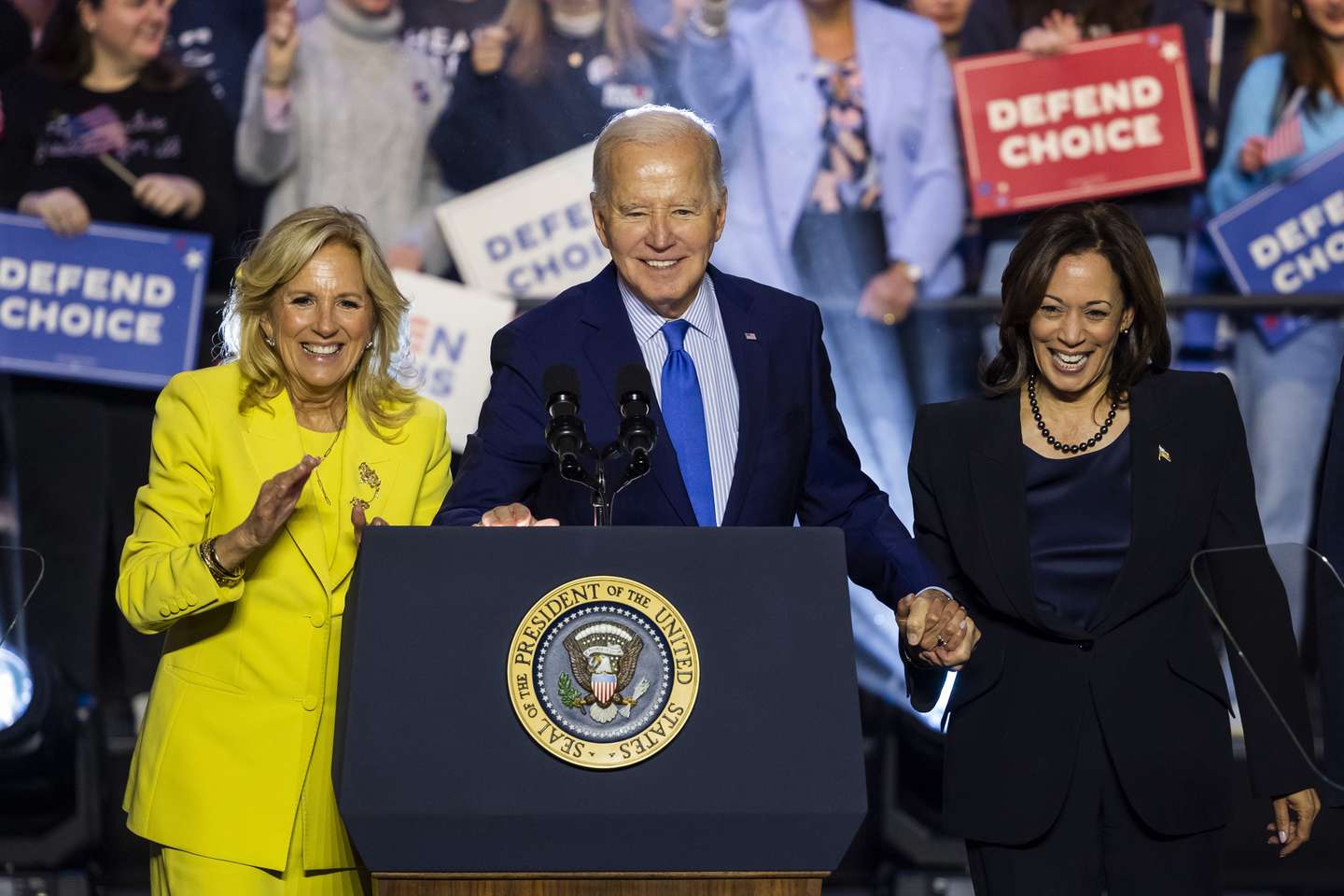 epa11099799 US President Joe Biden (C), along with First Lady Jill Biden (L), Vice President Kamala Harris (R), celebrate at a campaign rally for abortion rights at George Mason University in Manassas, Virginia, USA, 23 January 2024. The rally comes one day after the 51st anniversary of the Supreme Court's Roe v. Wade decision, which the high justices overturned in 2022.  EPA/JIM LO SCALZO