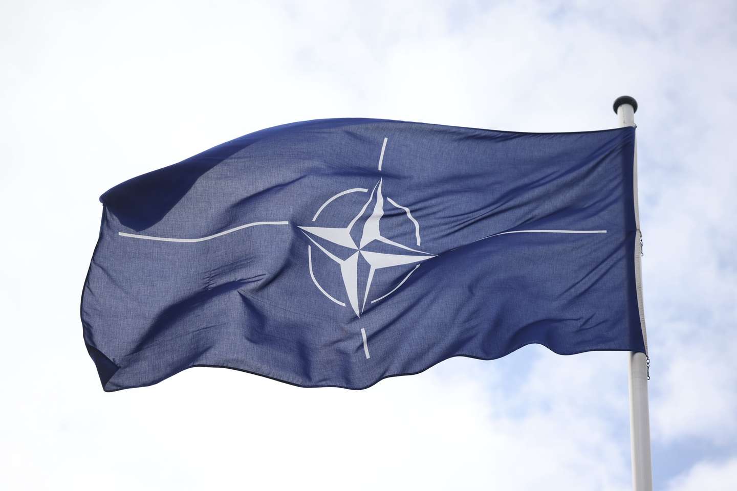 epa11258626 A NATO flag waves outside the German Ministry of Defense in Berlin, Germany, 04 April 2024. German Defense Minister Pistorius presented on the day his plans for a new structure of the country's armed forces 'Bundeswehr'.  EPA/CLEMENS BILAN