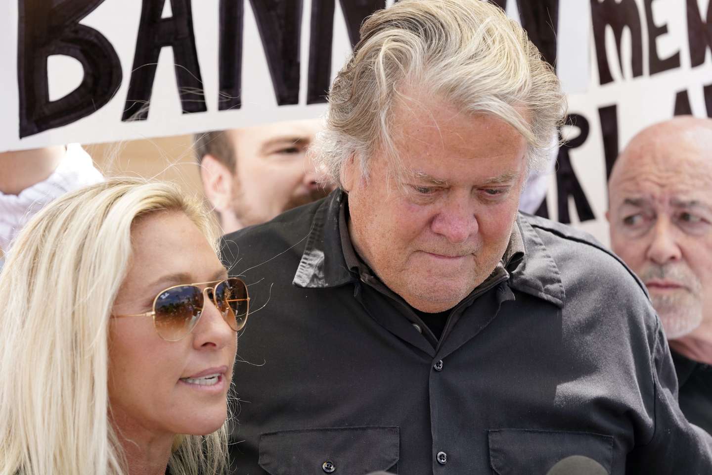 epaselect epa11450403 US Congresswoman Marjorie Taylor-Green (L) with former White House chief strategist to President Donald J. Trump Steve Bannon (R) speak to the media as he reports to federal prison Danbury, Connecticut, USA, 01 July 2024. Bannon was found guilty of contempt of Congress in 2022 for his refusal to comply with a subpoena issued by the Select Committee to Investigate the January 6th Attack.  EPA/MICHELLE MCCOUGHLIN