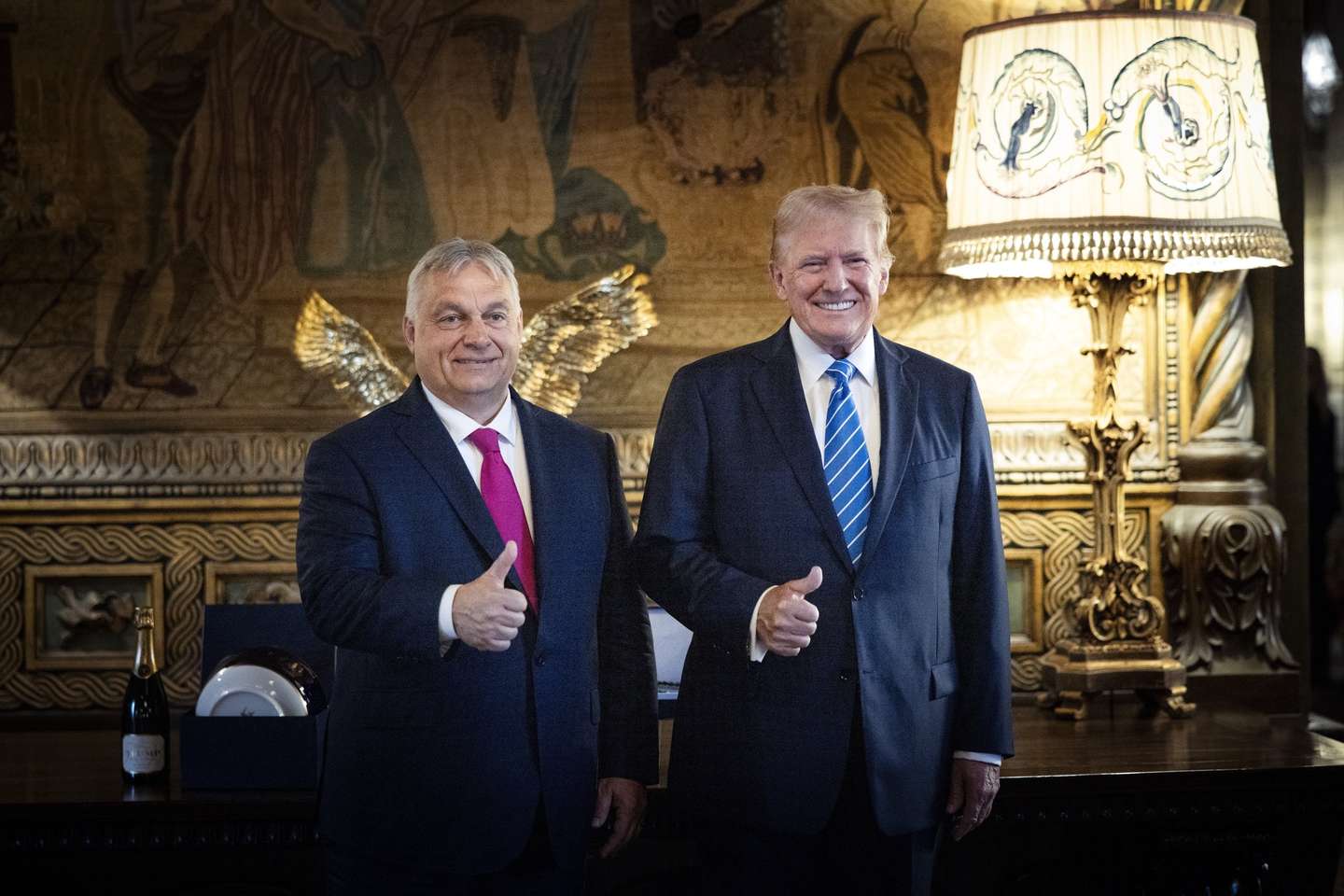 epa11473669 A handout photo made available bythe Hungarian PM’s Press Office shows Hungarian Prime Minister Viktor Orban (L) and former US president and Republican presidential candidate Donald Trump (R) posing for photographs during their meeting in Trump's Mar-a-Lago estate in Palm Beach, Florida, USA, 11 July 2024.  EPA/Zoltan Fischer HANDOUT HUNGARY OUTHANDOUT EDITORIAL USE ONLY/NO SALES