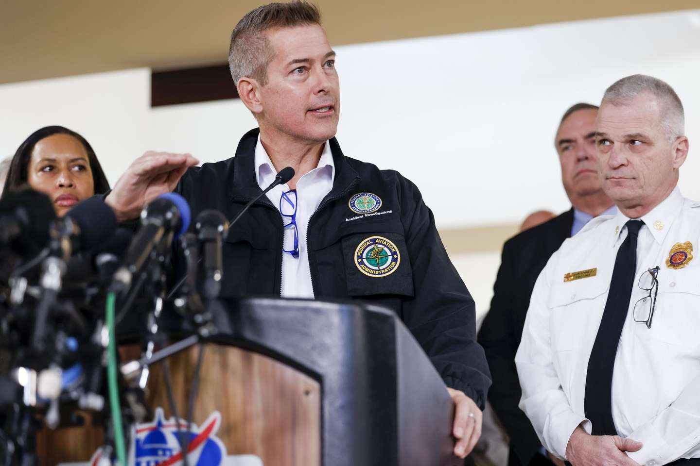 epa11863638 US Transportation Secretary Sean Duffy (C) gives updates about the collision of a passenger airplane and a military helicopter during a press conference at Ronald Reagan National Airport in Arlington, Virginia, USA, 30 January 2025. DC Fire and EMS Chief John Donnelly said no survivors are expected following the collision of an American Eagle Flight, with 60 passengers and four crew members on board, with a US Army Black Hawk helicopter carrying three US service members late on 29 January, over the Potomac River near Reagan Washington National Airport.  EPA/SHAWN THEW