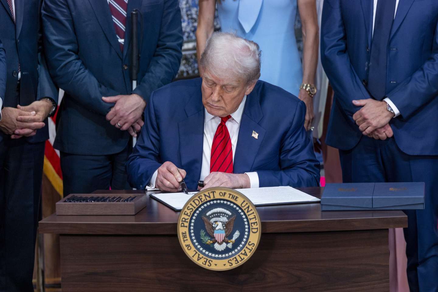 epa12285257 US President Donald J. Trump signs an executive order to establish an Olympic task force at the White House in Washington, DC, USA 05 August 2025. President Trump established a 2028 Los Angeles Olympic Games task force to ensure the event is “safe, seamless and historically successful.”  EPA/SHAWN THEW