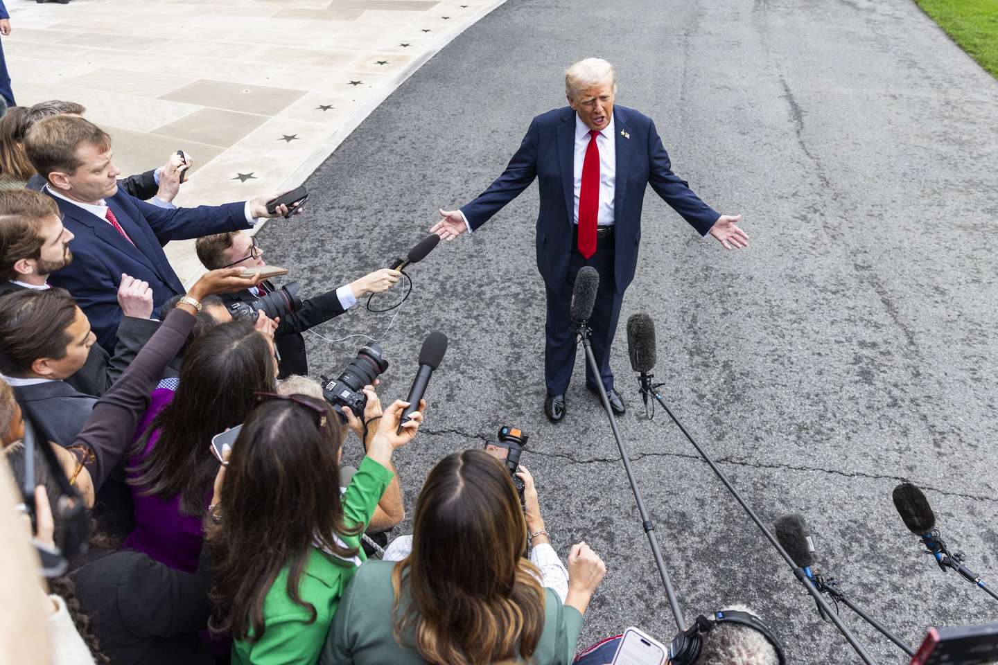 epaselect epa12416918 US President Donald Trump speaks to reporters as he departs the White House for a meeting with military leaders at Quantico Marine Base in Washington, DC, USA, 30 September 2025. The president answered questions about the gathering, saying 'We have our real warriors over there. And when they're not good, when we don't think they're our warriors, you know what happened? We say you're fired.'  EPA/JIM LO SCALZO