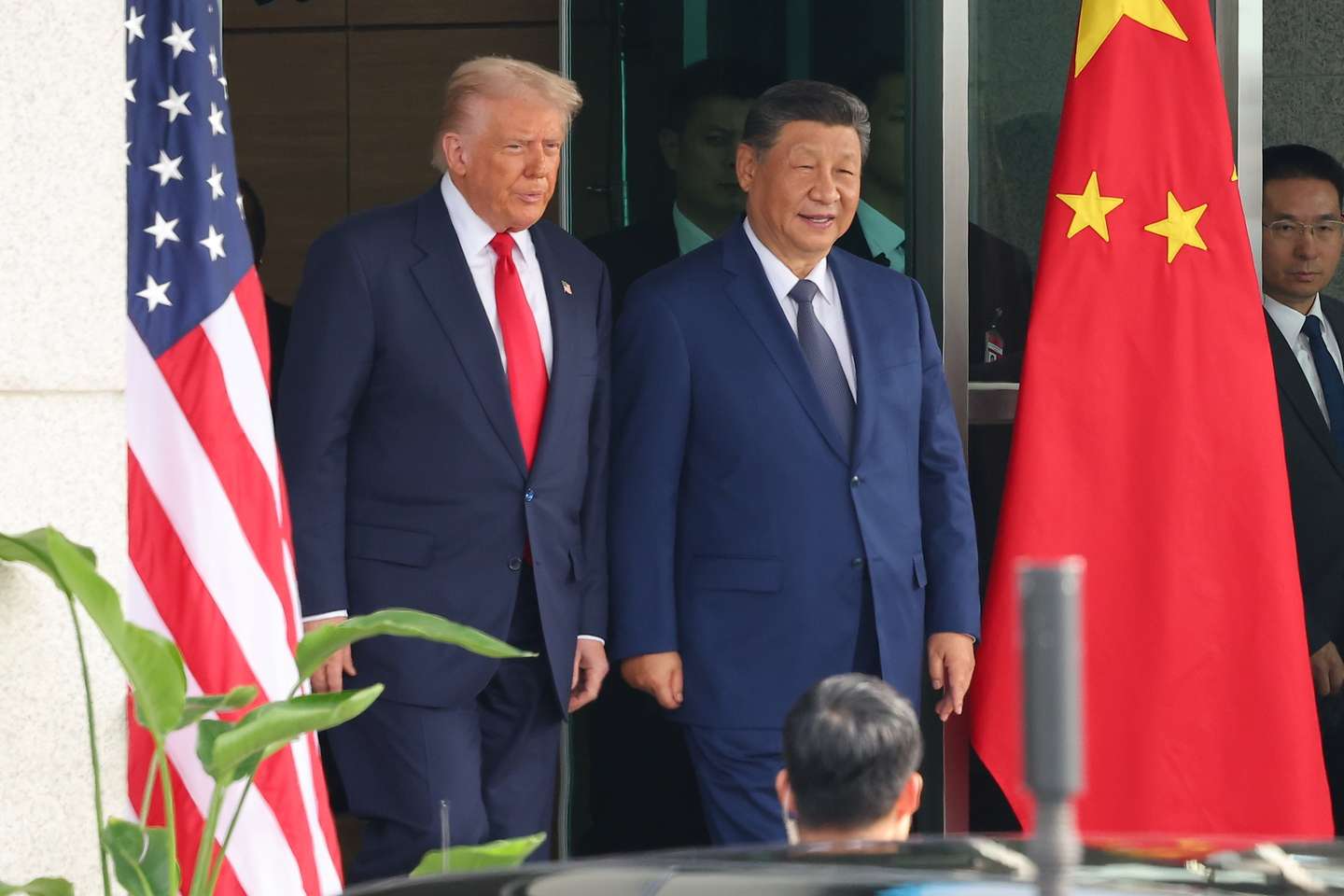 epa12492356 US President Donald Trump (L) and Chinese President Xi Jinping (C) emerge from their talks at the Naraemaru reception hall inside an Air Force base in Busan, South Korea, 30 October 2025.  EPA/YONHAP SOUTH KOREA OUT