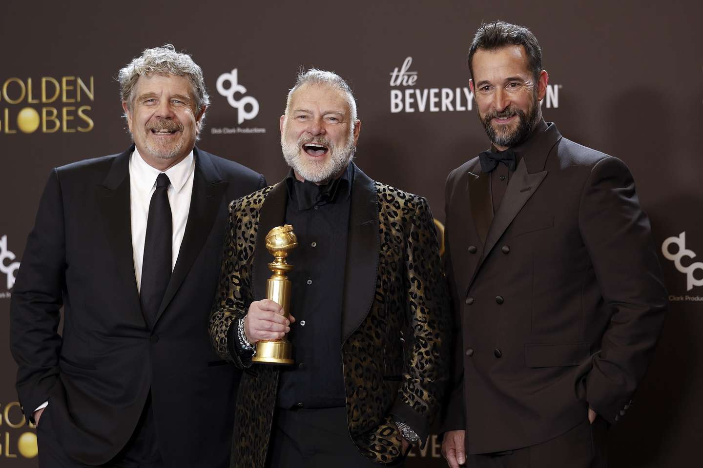 epa12643967 (L-R) US film producer John Wells, Canadian producer R. Scott Gemmill and US actor Noah Wyle pose with the best television series - drama award for 'The Pitt' during the 83rd annual Golden Globe Awards ceremony at the Beverly Hilton Hotel in Beverly Hills, California, USA, 11 January 2026. The Golden Globe Awards recognize outstanding achievements in the global film and television industries.  EPA/CHRIS TORRES