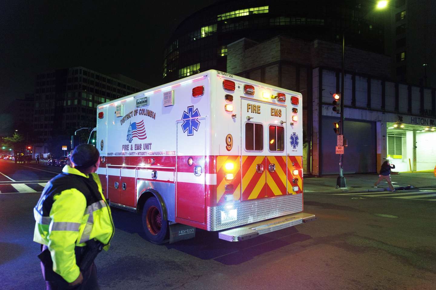 epa12914596 A emergency vehicle arrives outside the Washington Hilton after shots were fired outside the Washington Hilton ballroom hosting the White House Correspondents’ Association in Washington, DC, USA, 25 April 2026. The alleged shooter is in custody.  EPA/WILL OLIVER