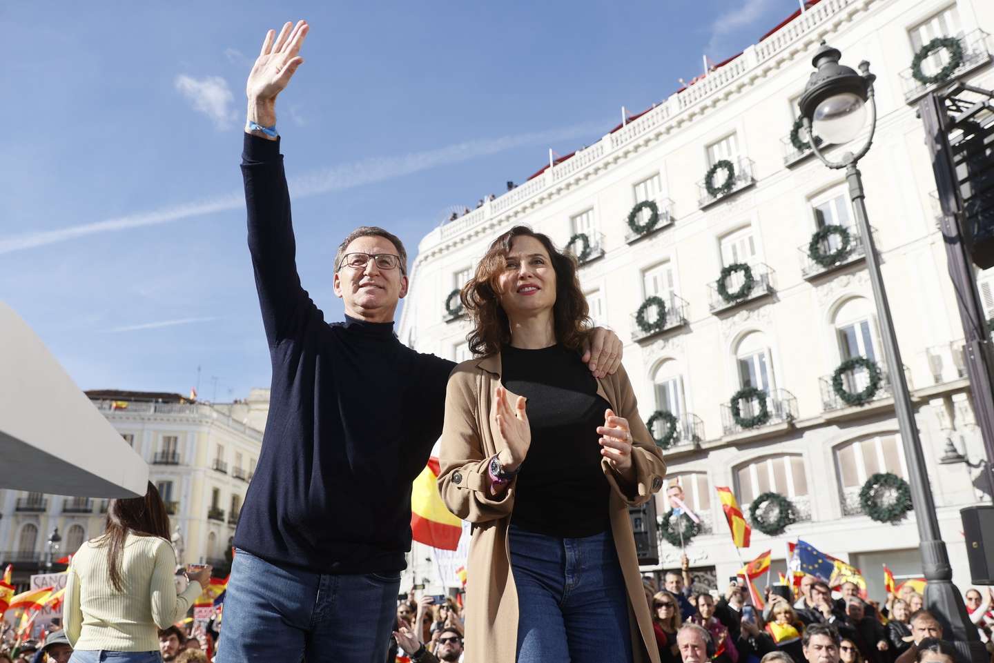 epa10971386 Leader of Spain's People's Party (PP) Alberto Nunez-Feijoo (L) and President of Madrid's regional Government Isabel Diaz Ayuso attend a demonstration called by right wing parties against the so-called Amnesty Law, at Puerta del Sol square in Madrid, Spain, 12 November 2023. Spain's ruling party PSOE struck a deal with Catalan pro-independence party Junts per Catalunya (JxCat), led by former Catalan President Carles Puigdemont, so that Spain's acting Prime Minister Pedro Sanchez can be invested for a second term. In exchange for the key support of his seven JxCat MPs, Puigdemont demanded an amnesty for hundreds of people who faced legal action over their roles in Catalonia's failed push for independence in 2017.  EPA/MARISCAL