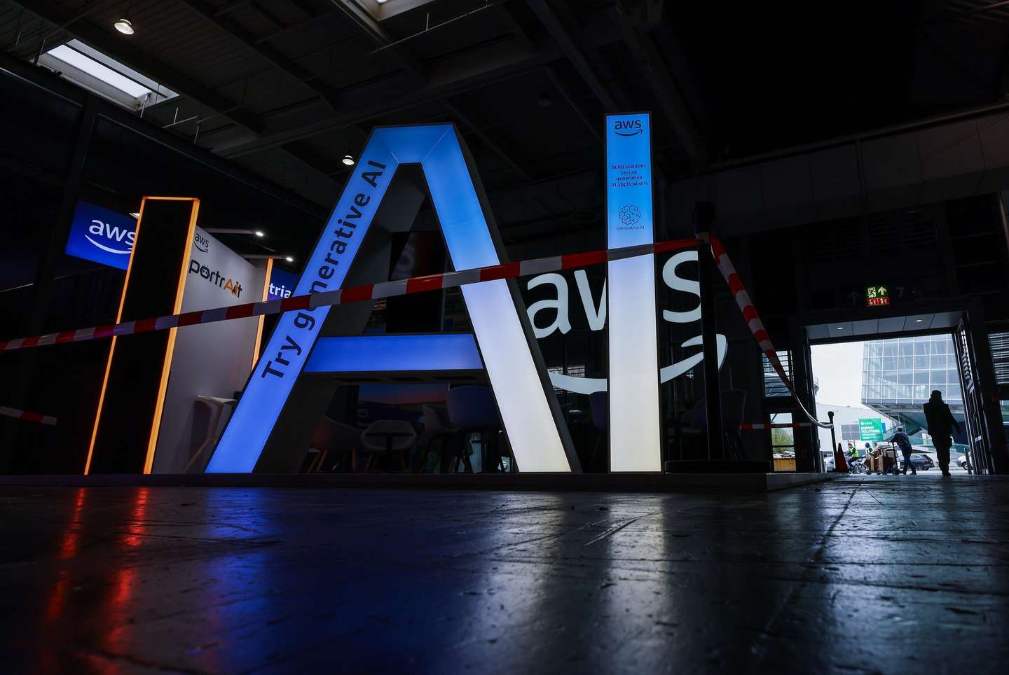 epa11999349 The lettering AI for 'Artificial Intelligence' stands at the Amazon Web Services AWS stand during preparations at the Hanover Fair (Hannover Messe) in Hanover, Germany, 30 March 2025. More than 4,000 exhibitors are expected to showcase their innovations from 31 March to 04 April at what is billed as the world's largest industrial trade fair, with visitors from approximately 150 countries expected. The main focus this year is on robotics, mechanical engineering, power-train technology, and energy production under the motto 'Energizing a Sustainable Industry.' The partner country in 2025 is Canada.  EPA/HANNIBAL HANSCHKE