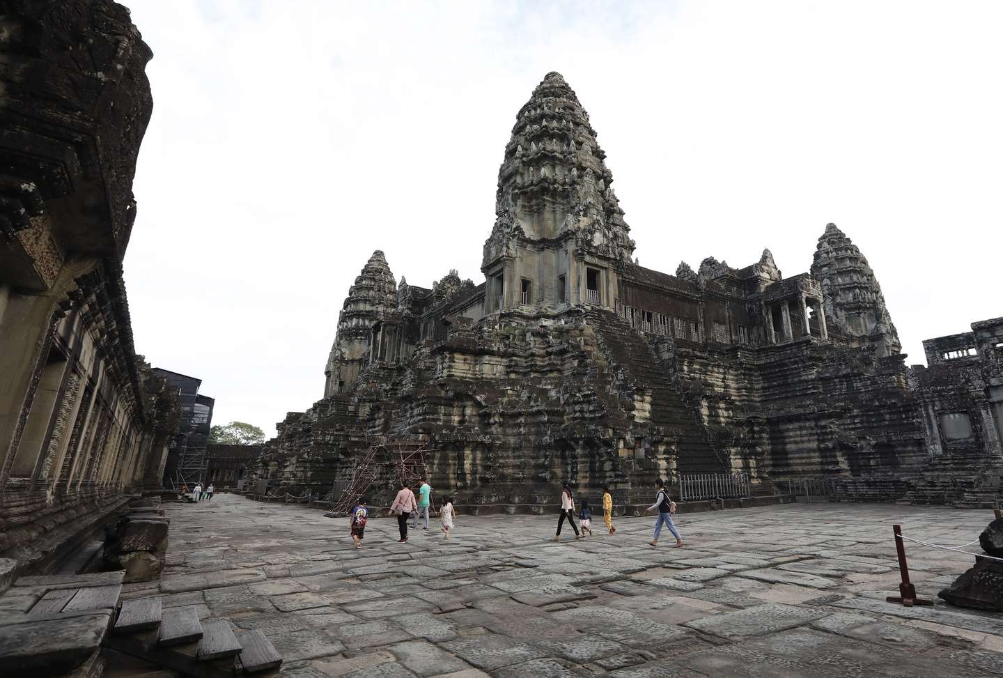epa08850434 Tourists visit Angkor Wat temple in Siem Reap province, Cambodia, 29 November 2020. According to local ?media reports, Cambodian Government has granted NagaCorp a 50-year lease on land for a theme park project south of the Angkor Wat complex, which attracts about five million tourists each year.  EPA/MAK REMISSA