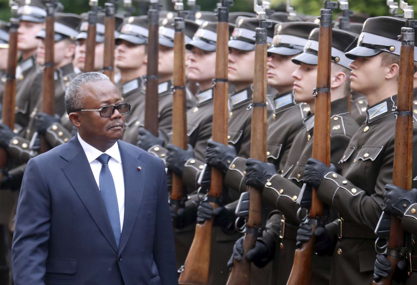 epa12168118 President of Guinea-Bissau Umaro Sissoco Embalo walks past the honor guard during a welcoming ceremony hosted by the Latvian president prior to their meeting in Riga, Latvia, 10 June 2025. During the meeting, both presidents discussed bilateral relations between the two countries, current security challenges in Africa and Europe, and cooperation in international organizations.  EPA/TOMS KALNINS