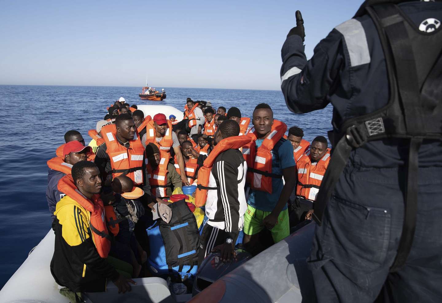 epa08495268 An undated handout photo made available by Sea-Watch.org shows more than 90 migrants on a toy boat as they are rescued by Sea Watch, 30km away off the Libyan Coast (issued 19 June 2020). German NGO Sea Watch has rescued three groups of migrants in less than 48 hours, and have asked permission to urgently dock at some port.  EPA/LAILA SIEBER / SEA-WATCH.ORG / HANDOUT  HANDOUT EDITORIAL USE ONLY/NO SALES/NO ARCHIVES