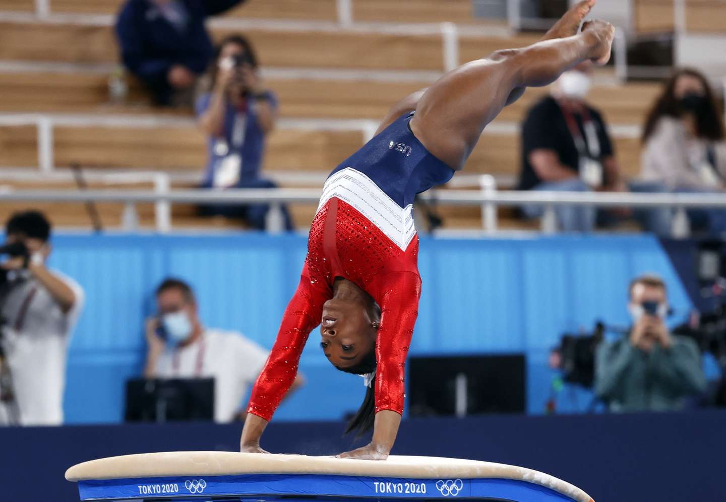 epa09370182 Simone Biles of the USA performs on the Vault during the Women's Team final during the Artistic Gymnastics events of the Tokyo 2020 Olympic Games at the Ariake Gymnastics Centre in Tokyo, Japan, 27 July 2021.  EPA/HOW HWEE YOUNG