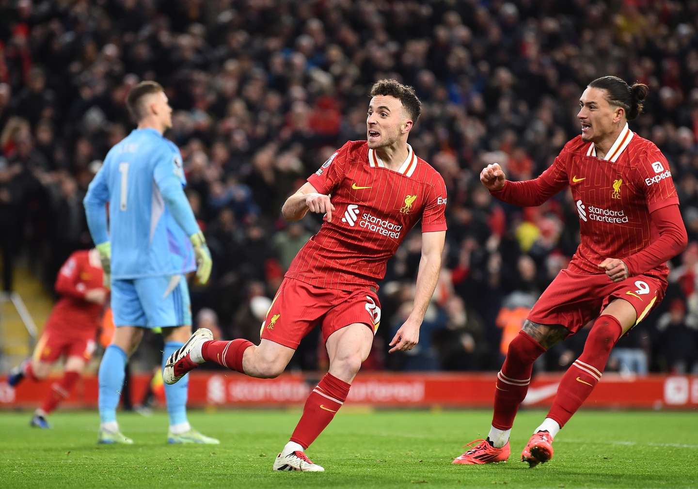 epa11777062 Liverpool's Diogo Jota (L) celebrates with Darwin Nunez (R) celebrates after scoring the 2-2 goal during the English Premier League soccer match between Liverpool FC and Fulham FC, in Liverpool, Britain, 14 December 2024.  EPA/PETER POWELL