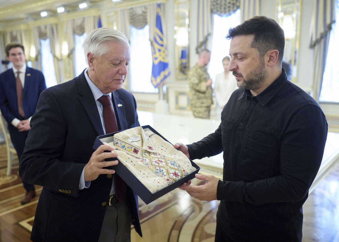 epa13103355 A handout photo made available by Ukraine's Presidential Press Service shows Ukrainian President Volodymyr Zelensky (R) presenting Vyshyvanka, a traditional Slavic embroidered shirt, to US Republican Senator from South Carolina, Lindsey Graham (L) during a meeting in Kyiv, Ukraine, 10 July 2026. Lindsey Graham arrived in Kyiv to meet with top Ukrainian officials amid the ongoing Russian invasion.  EPA/PRESIDENTIAL PRESS SERVICE HANDOUT HANDOUT    HANDOUT EDITORIAL USE ONLY/NO SALES