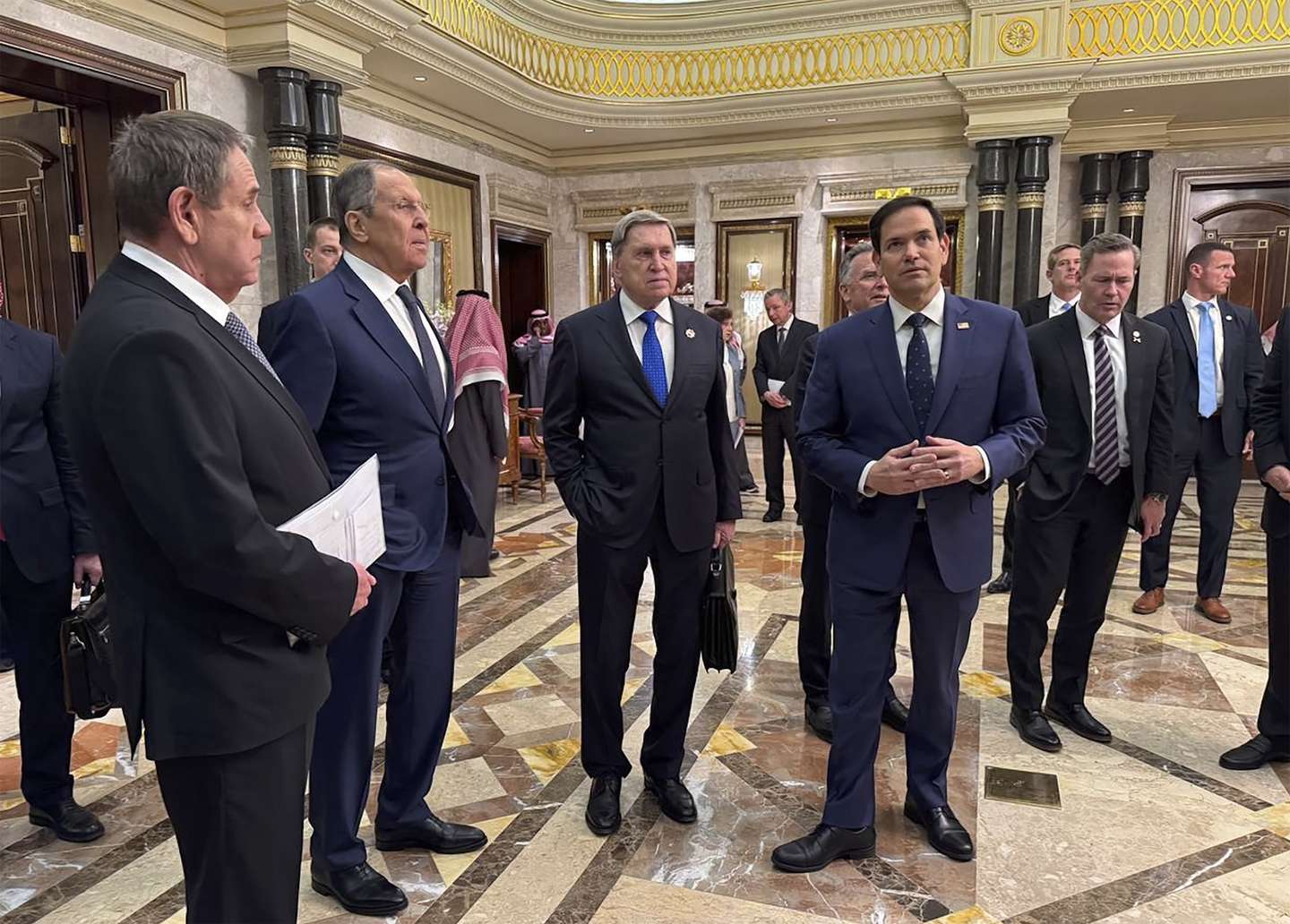 epa11904428 A handout photo made available by the Russian Foreign Ministry Press Service shows Russian Foreign Minister Sergey Lavrov (2-L) and Russian presidential aide Yury Ushakov (2-R) speaking with U.S. Secretary of State Marco Rubio (R), U.S. National Security Advisor Mike Waltz (L), and U.S. Middle East envoy Steve Witkoff (R) after their meeting at Diriyah Palace in Riyadh, Saudi Arabia, 18 February 2025. The agenda of the meeting of the Russian presidential aide Yuri Ushakov, Russian Foreign Minister Sergey Lavrov with American officials in Riyadh on 18 February is devoted to the restoration of the entire range of bilateral relations, as well as the preparation of possible negotiations on the Ukrainian settlement, the Kremlin reported.  EPA/RUSSIAN FOREIGN MINISTRY PRESS SERVICE HANDOUT HANDOUT EDITORIAL USE ONLY/NO SALES