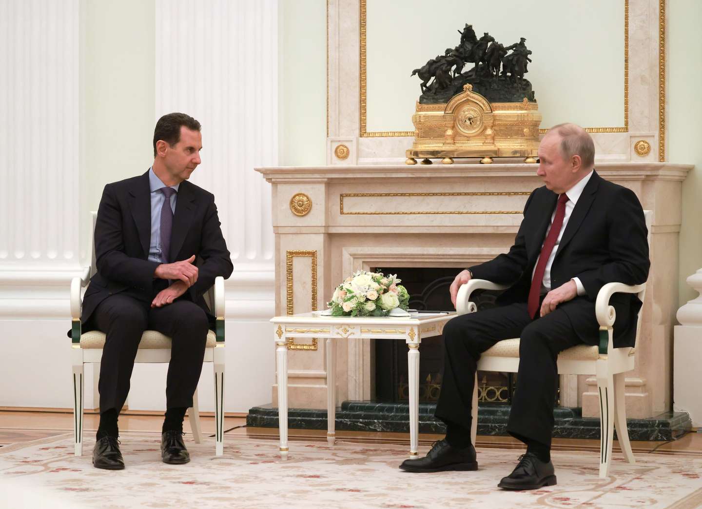 epa10524518 Russian President Vladimir Putin (R) speaks with Syrian President Bashar al-Assad (L), during their meeting at the Kremlin in Moscow, Russia, 15 March 2023. The Syrian President is in Moscow on an official visit.  EPA/VLADIMIR GERDO / SPUTNIK / KREMLIN POOL MANDATORY CREDIT