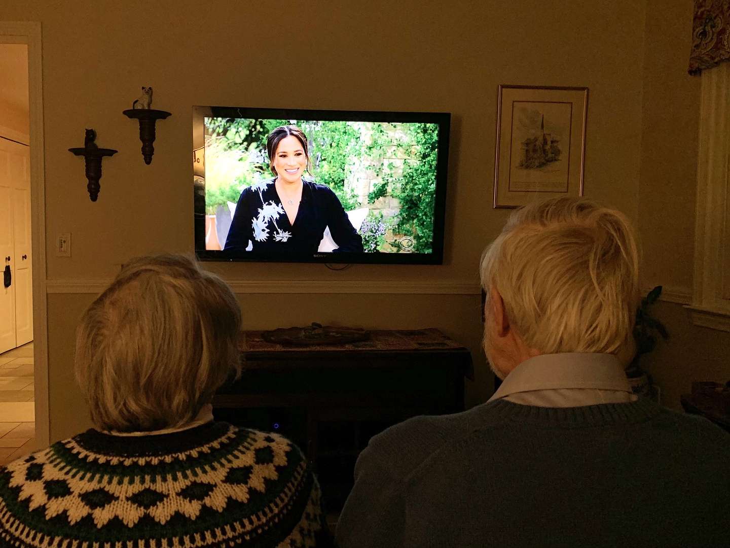 epa09060476 Ruth (L) and Ken (R) Campbell watch a televised interview by US television personality Oprah Winfrey of Britain's Harry and Meghan, Duke and Duchess of Sussex on the US netwrok CBS in West Roxbury, Massachusetts, USA, 07 March 2021.  EPA/KATE CAMPBELL